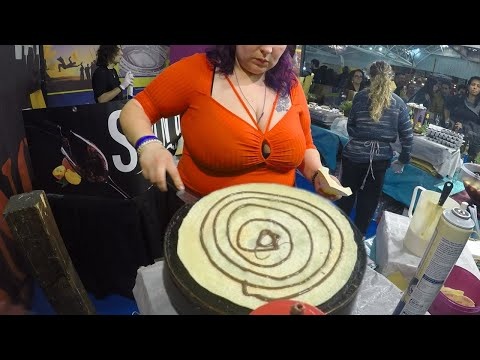 Girls Prepare Crepes, Churros, Chocolate Fountain on Waffle. Italy Street Food Event